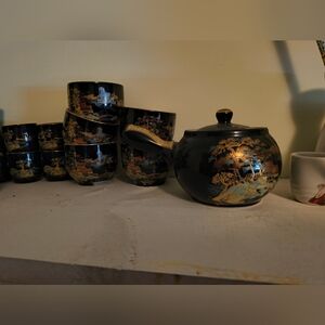 Black and Gold Ceramic Art with Intricate Designs